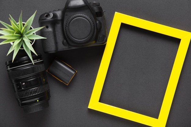 flat-lay-camera-yellow-frame_23-2148363424 digita marketing services- rise marketing llc