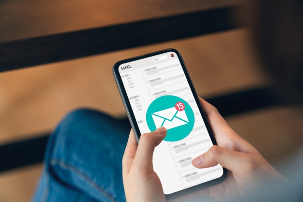 hand-holding-phone-show-email-screen-application-mobile_175201-81 digital marketing services by rise marketing llc